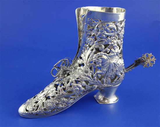 An early 20th century Hanau pierced silver ornamental model of a ladys shoe with spur, 13 oz.